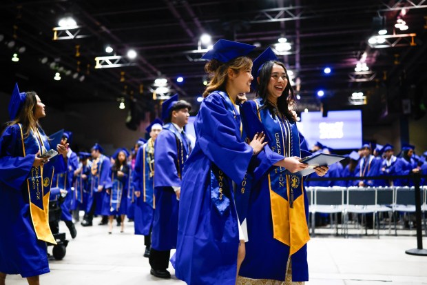 Graduates walk towards the exit after The Lucas College and Graduate School of Business graduation ceremony at SJSU in San Jose, Calif., on Thursday, May 21, 2026. (Shae Hammond/Bay Area News Group)