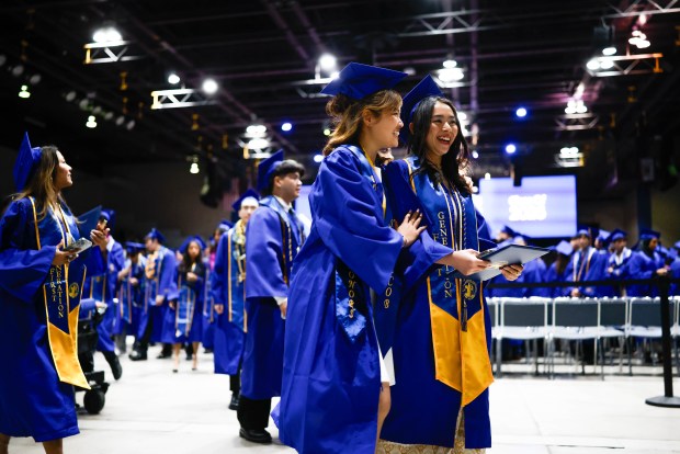 Graduates walk towards the exit after The Lucas College and Graduate School of Business graduation ceremony at SJSU in San Jose, Calif., on Thursday, May 21, 2026. (Shae Hammond/Bay Area News Group)