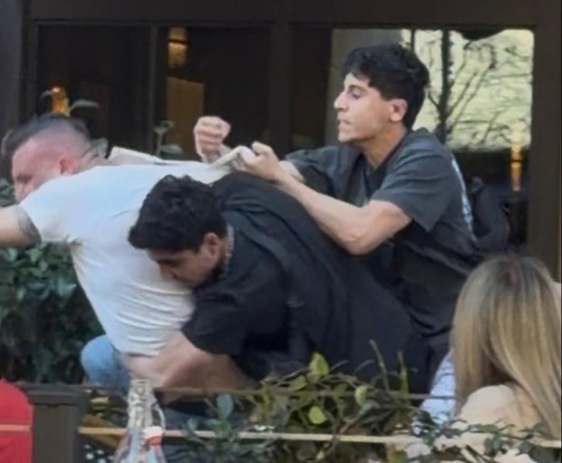 Frame from video of two men attacking another man at a Santana Row restaurant on Sunday afternoon. The incident is being investigated as a potential hate crime, authorities said. (Frame from video courtesy of Melissa Escudero)