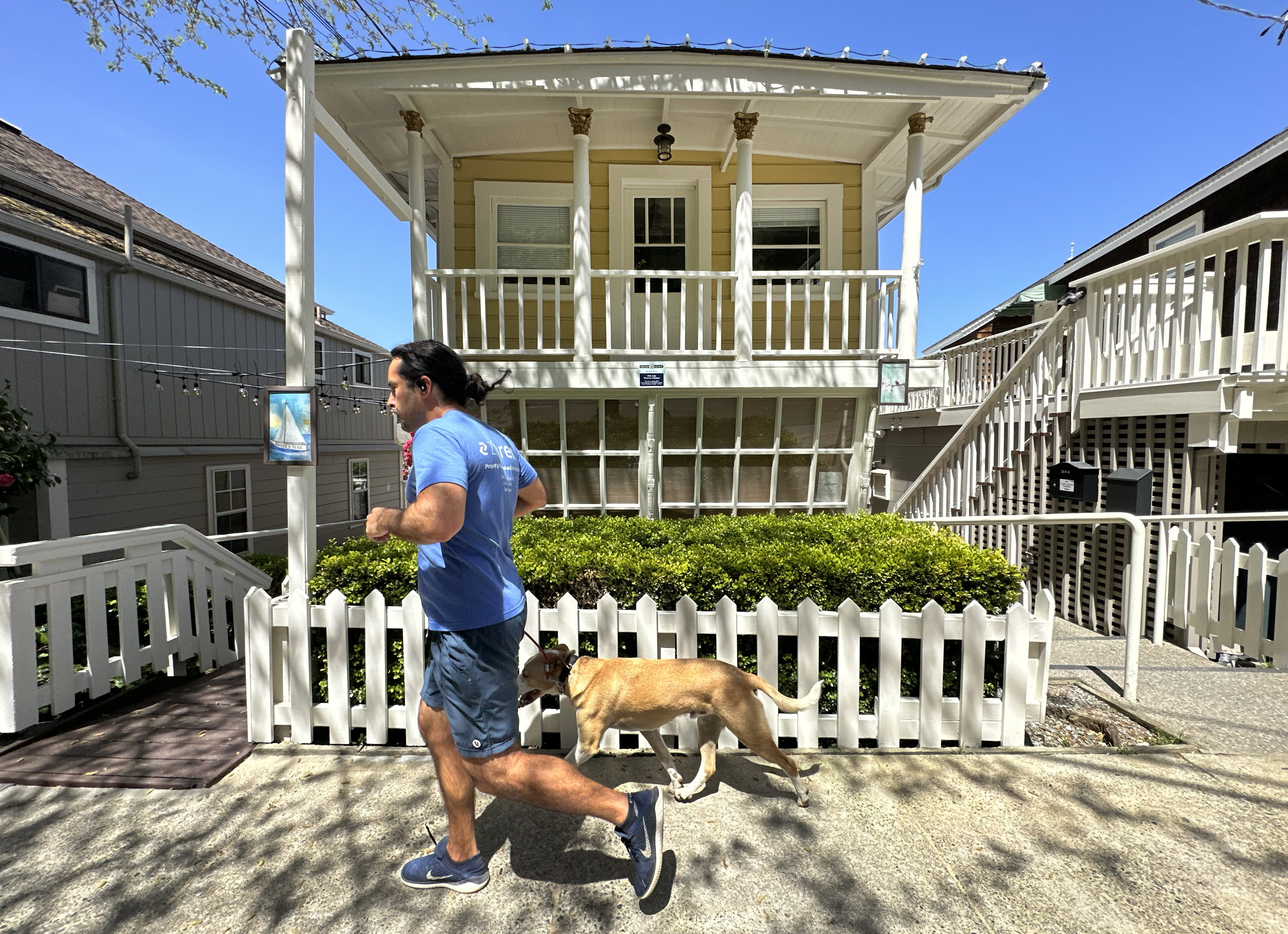 A jogger runs past a building at historic Ark Row...