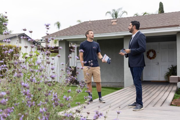 Ammar Campa-Najjar, right, speaks with Sean Clark while canvassing on Tuesday, May 12, 2026, in Escondido. (Luke Johnson / The San Diego Union-Tribune)