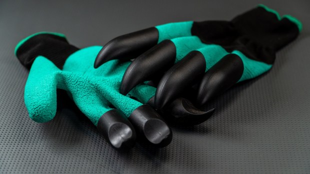 Claw gloves make digging in soil easier. (Adobe Stock)