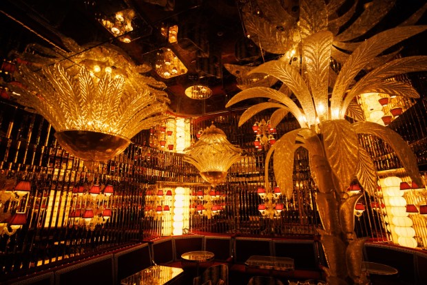 Fallen Empire, a hidden oyster and champagne bar within the lobby, features mirrored walls and solid brass booths at the Baby Grand hotel in Coronado (Kristian Carreon / The San Diego Union-Tribune)