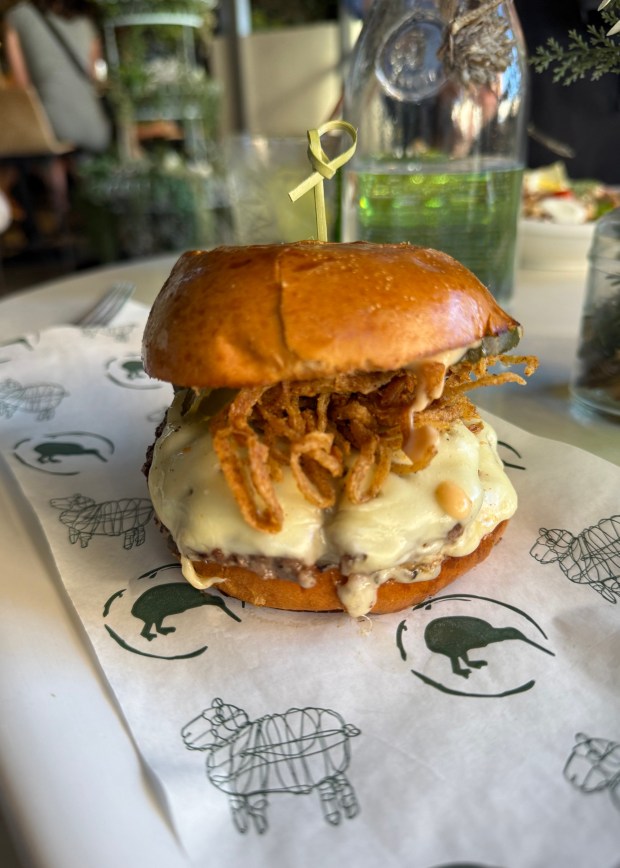 The Wagyu Smashburger at Queenstown Village in La Jolla two wagyu smashed patties topped with American cheese, pickles, Thousand Island dressing and fried habañero onions. (Michael James Rocha / Union-Tribune)