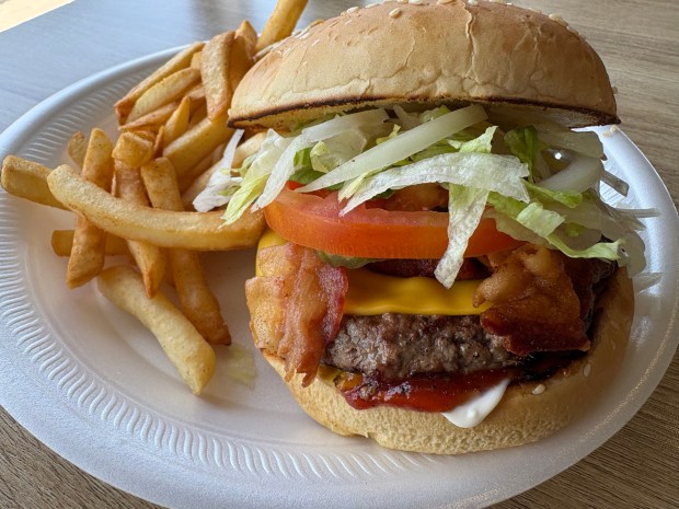 This 8 ounce steak burger with bacon is served at Canada Steak Burger located in Chula Vista. (Jayne Yutig / The San Diego Union Tribune)