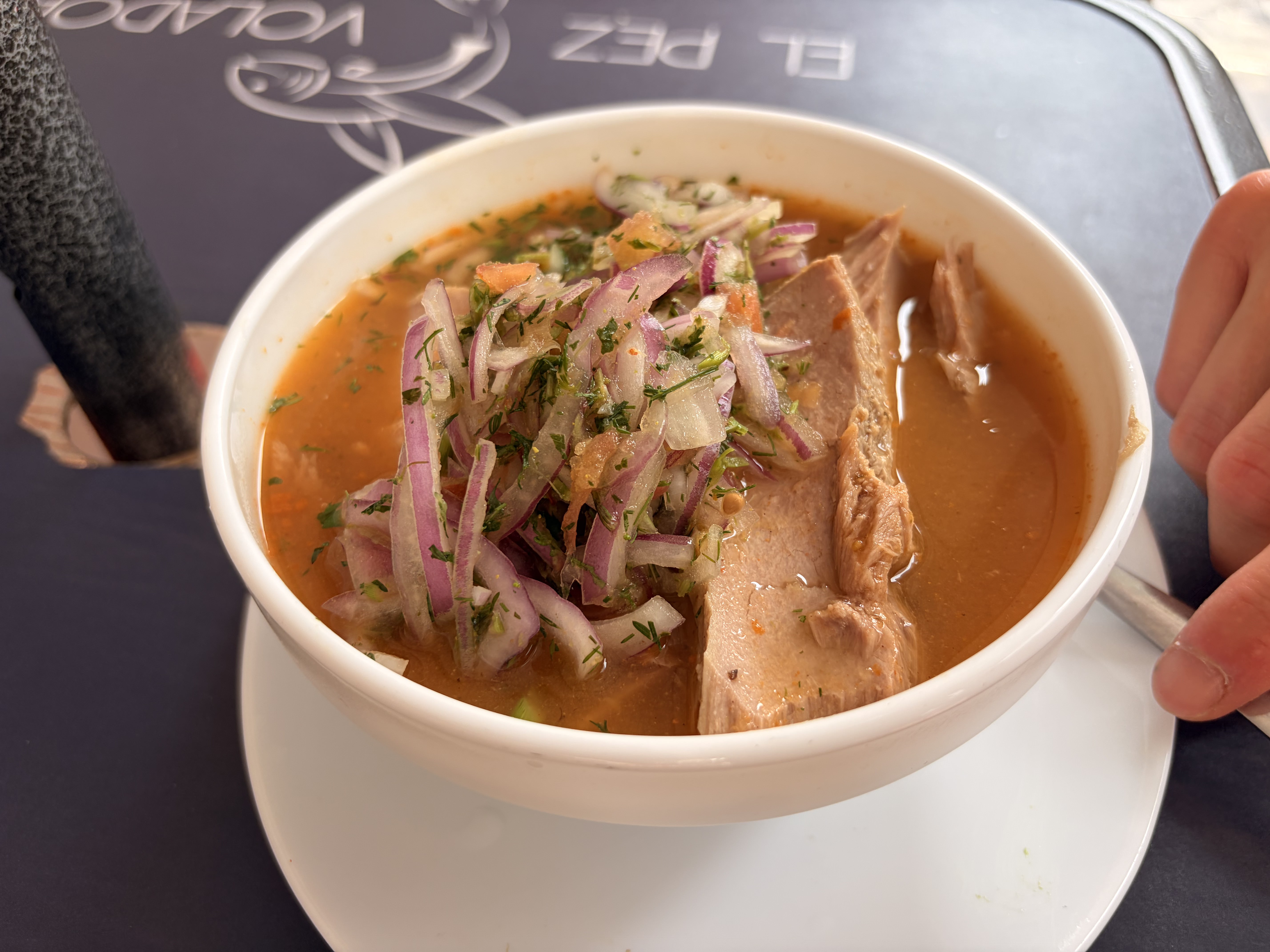 Encebollado, a hearty stew made from tuna, yucca and pickled...
