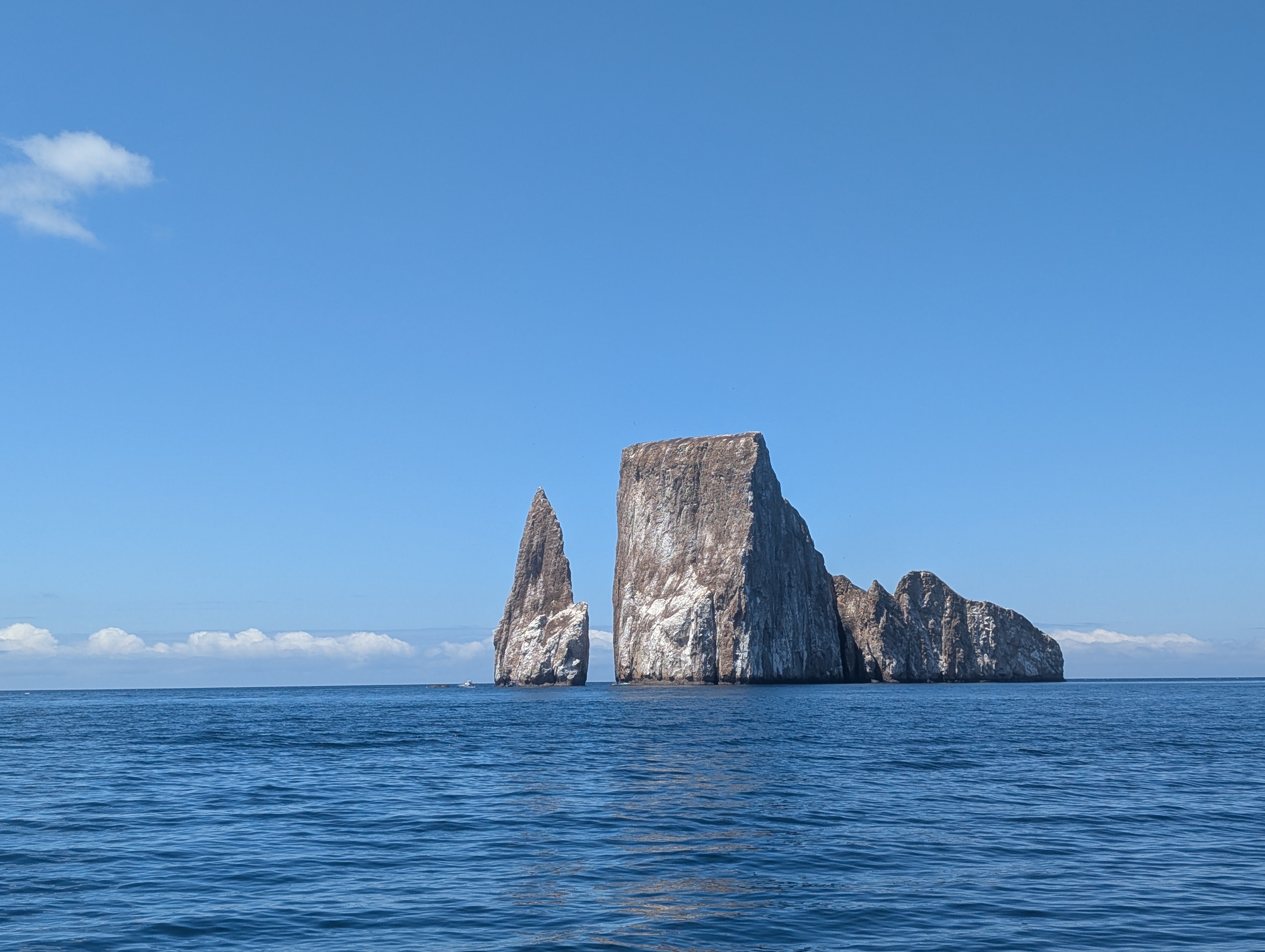 The towering volcanic pillars of Kicker Rock were formed two...