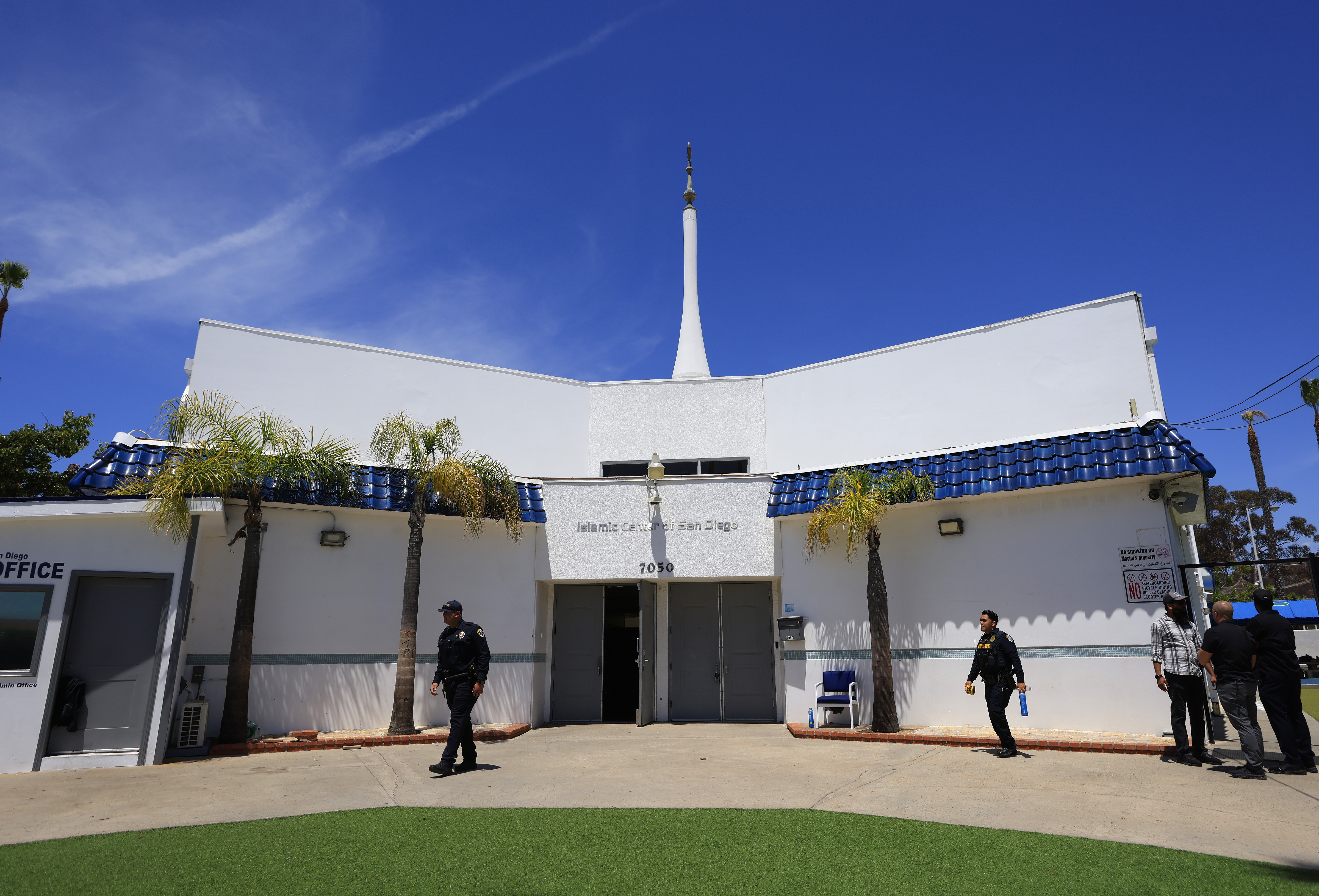 A San Diego Police Sgt. guards the Islamic Center of...