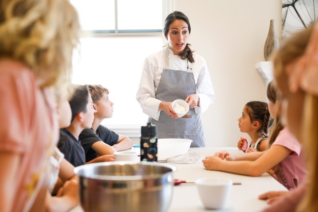 Jessica Baldwin instructs students during a class at her cooking school, Le Petit Pâtissier, which she operates from her Carmel Valley home. (Meg McLaughlin / The San Diego Union-Tribune)