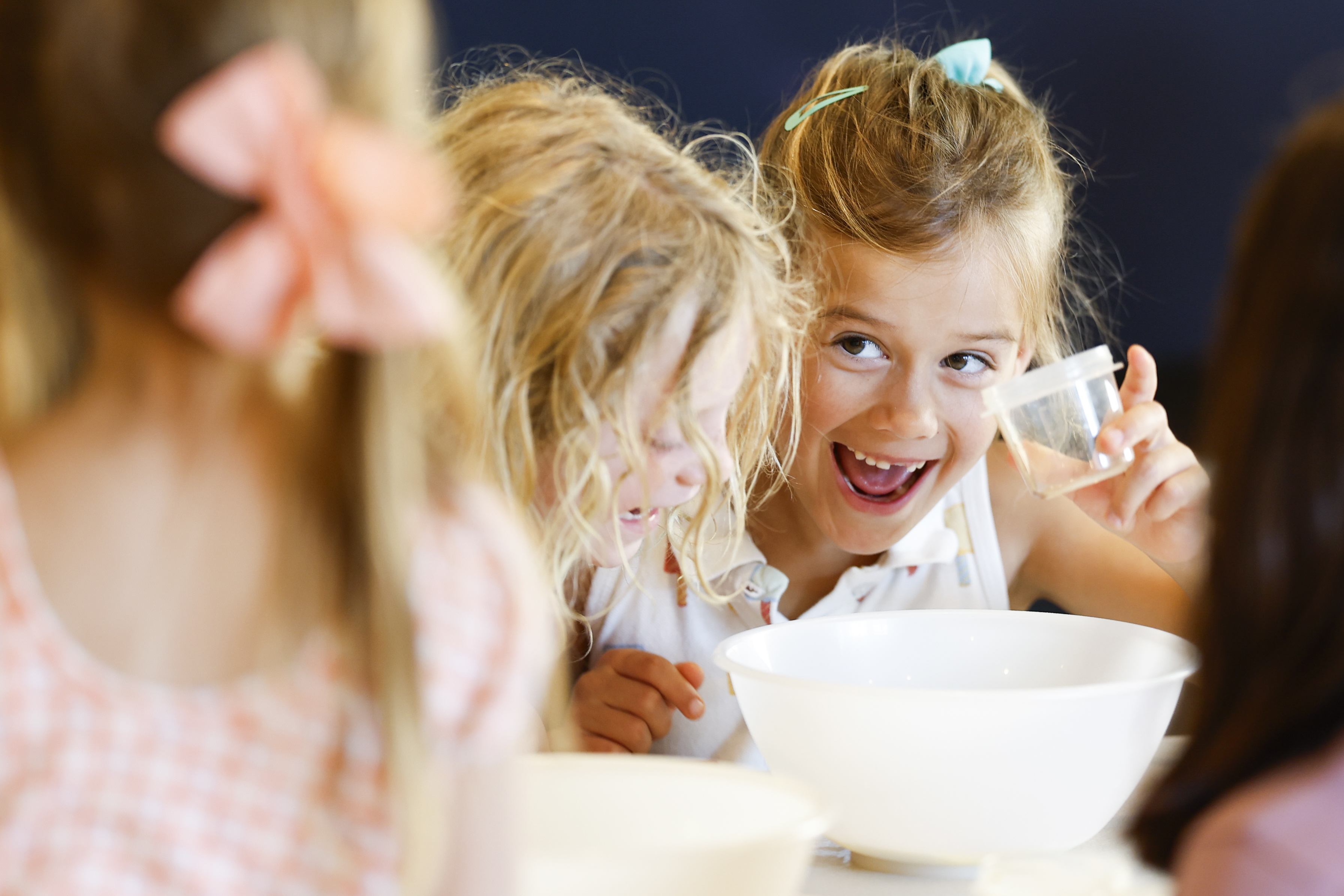 Taylor Ward, 6, of Del Mar, smiles after successfully pouring...