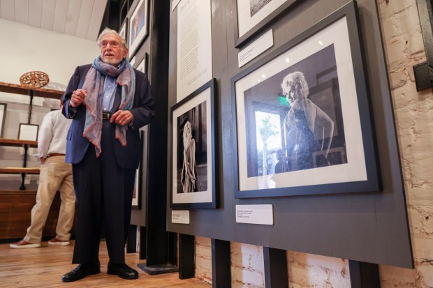 Photographer Lawrence Schiller , who documeted Marilyn Monroe extensively throughout her career, stands next to some of his images during a media night preview of Marilyn Monroe: The Defining Roles, at the Ice House Museum at the Hotel Del Coronado on Friday, May 29, 2026. The exhibit is celebrating her 100th birthday and will run from May 30th through July 31st. (Photo by Sandy Huffaker for The San Diego Union-Tribune)