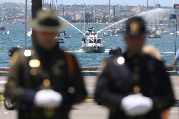 A police boat shoots out water during the 40th Annual Law Enforcement Officerxe2x80x99s Memorial Ceremony, honouring La Mesa Police Officer Lauren Craven who was struck and killed by a vehicle after stopping to assist a multi-vehicle crash last October, at the County Administration Building in San Diego on Wednesday, May 06, 2026. (Hayne Palmour IV / For The San Diego Union-Tribune)