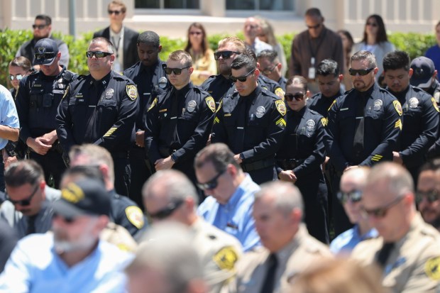 Law officers attend the 40th annual Law Enforcement Officer's Memorial Ceremony, honoring La Mesa Police Officer Lauren Craven who was struck and killed by a vehicle after stopping to assist a multi-vehicle crash last October, at the County Administration Building in San Diego on Wednesday, May 6, 2026. (Hayne Palmour IV / For The San Diego Union-Tribune)