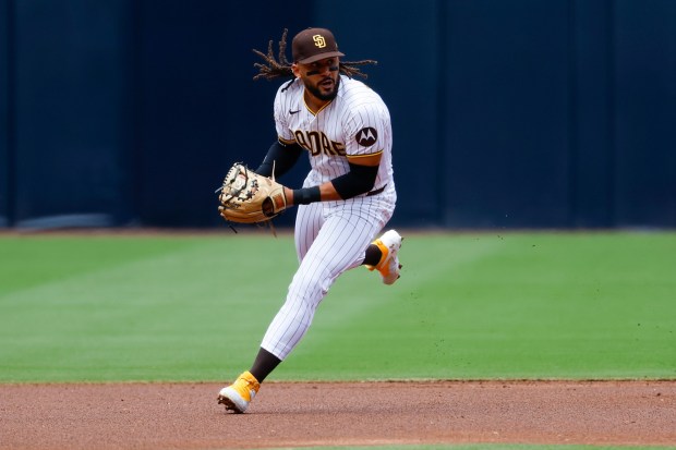 Fernando Tatis Jr. #23 of the San Diego Padres fields a ground ball against the Philadelphia Phillies during the first inning at Petco Park on Wednesday, May 27, 2026 in San Diego, California. (Meg McLaughlin / The San Diego Union-Tribune)