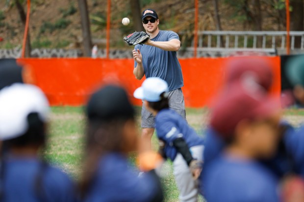 Mason Miller of the San Diego Padres plays catch with young players during the team's kids clinic at Liga Infantil de Beisbol Olmeca A.C on Friday, April 24, 2026 in Mexico City. (Meg McLaughlin / The San Diego Union-Tribune)