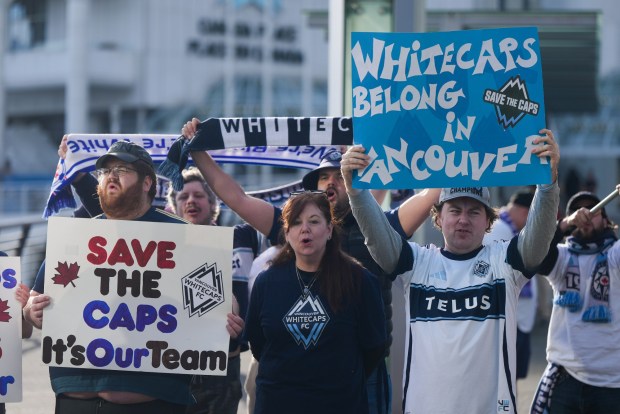 Fans of the Vancouver Whitecaps MLS soccer team rally to keep the team in Vancouver, Thursday, April 30, 2026, outside the 76th FIFA Congress in Vancouver, British Columbia. (Darryl Dyck/The Canadian Press via AP)
