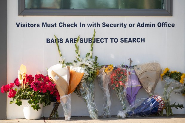 San Diego, CA - Flowers are laid against the recently funded security center at the San Diego Islamic Center in San Diego on Friday, May 22, 2026. (Luke Johnson / The San Diego Union-Tribune)