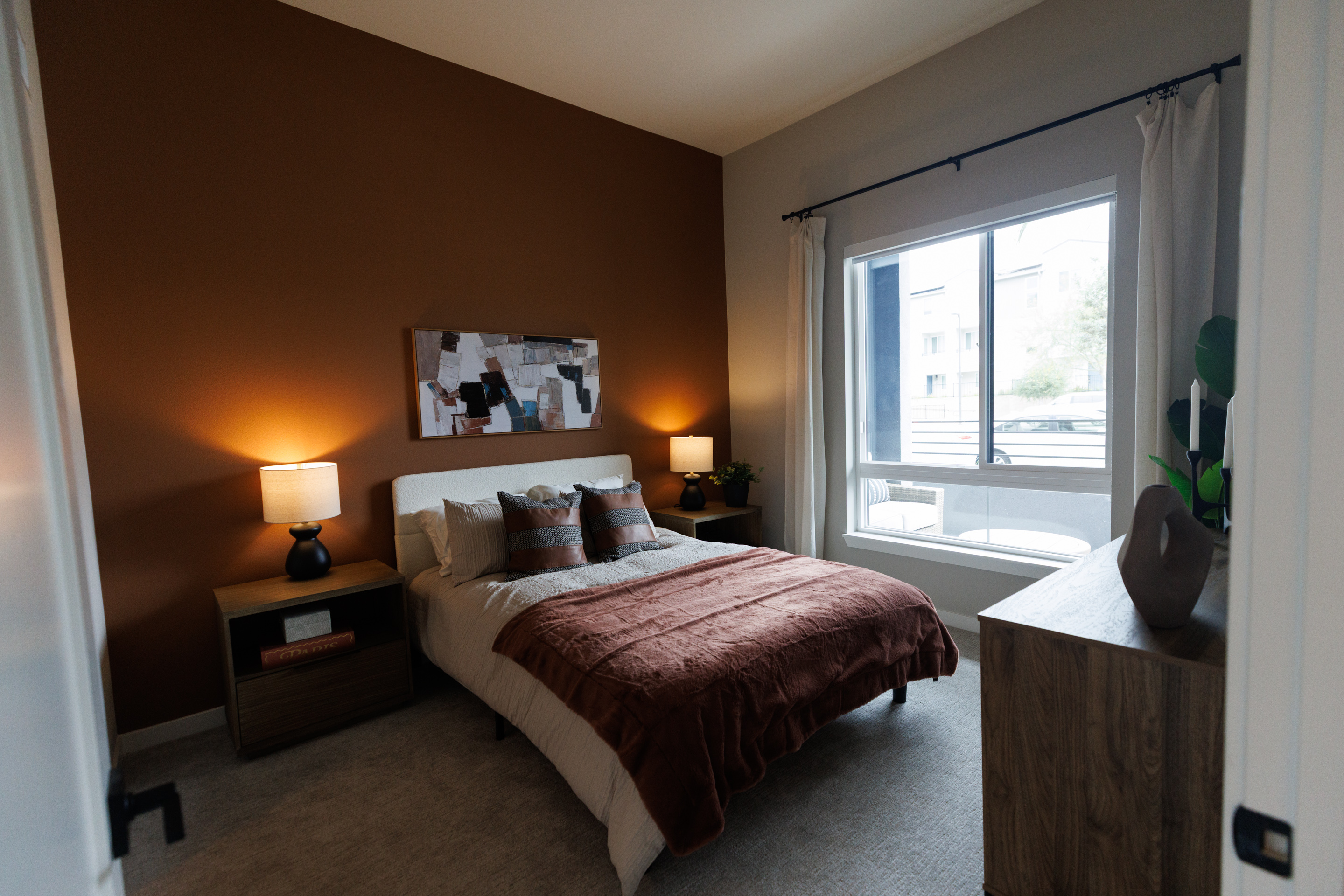 The bedroom of a one-bedroom apartment at VAYA apartment complex....