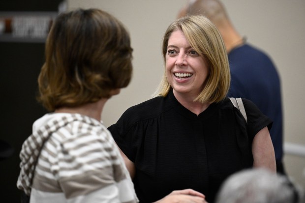San Diego City Councilmember Marni von Wilpert, right, talks with Barb Amador at a candidate forum held by the Democratic Club of Vista on March 13, 2026, in Vista. (Photo by Denis Poroy)
