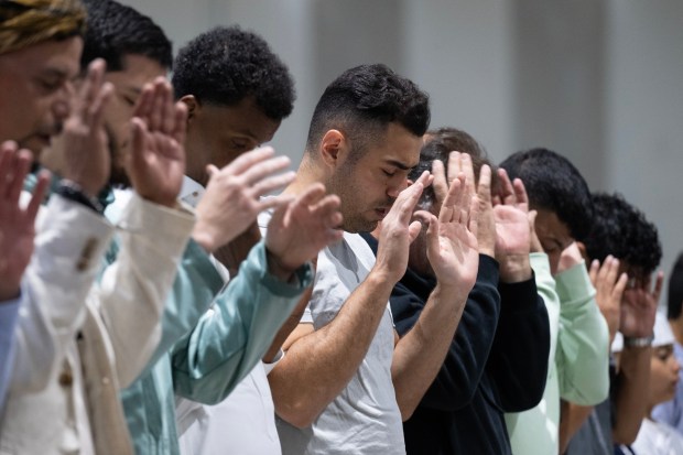 San Diego, CA - Community members come together to pray during the Islamic holiday Eid al-Adha at the San Diego Convention Center on Wednesday, May 27, 2026, in San Diego, CA. The community is coming together to heal during the "Festival of Sacrifice" nine days after the Islamic Center of San Diego was the target of a shooting. (Luke Johnson / The San Diego Union-Tribune)