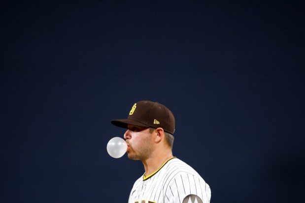 Ty France #4 of the San Diego Padres blows a bubble during the fifth inning against the Detroit Tigers at Petco Park on Friday, March 27, 2026 in San Diego, California. (Meg McLaughlin / The San Diego Union-Tribune)