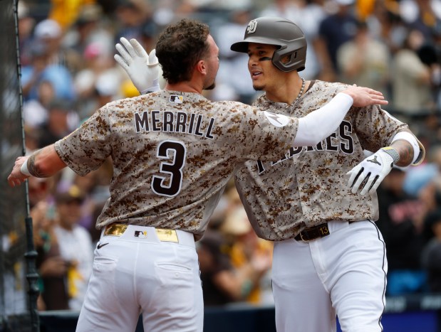 Manny Machado #13 of the San Diego Padres celebrates with Jackson Merrill #3 after hitting a solo home run in the fourth inning against the Chicago White Sox at Petco Park on May 3, 2026 in San Diego, CA. (K.C. Alfred / The San Diego Union-Tribune)