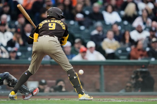 San Diego Padres' Jake Cronenworth (9) is hit by a pitch during the third inning of a baseball game against the San Francisco Giants, Monday, May 4, 2026, in San Francisco. (AP Photo/Godofredo A. VÃ¡squez)