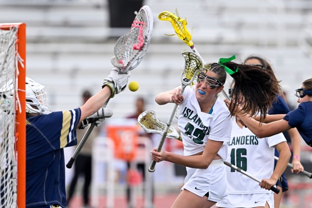 Coronado's Siena Kieffer (22) shoots past La Costa Canyon goalie Cambria Williams (1) during the CIF San Diego Section Open Division girls lacrosse championships May 16, 2026 in San Diego, Calif. (Photo by Denis Poroy)