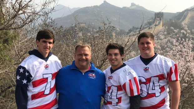 El Camino High School football players Jaden Casey (left to right) Jagger Knapp and Quinn Kerwin join coach Jerry Ralph at the Great Wall during a trip to China. (Courtesy photo)