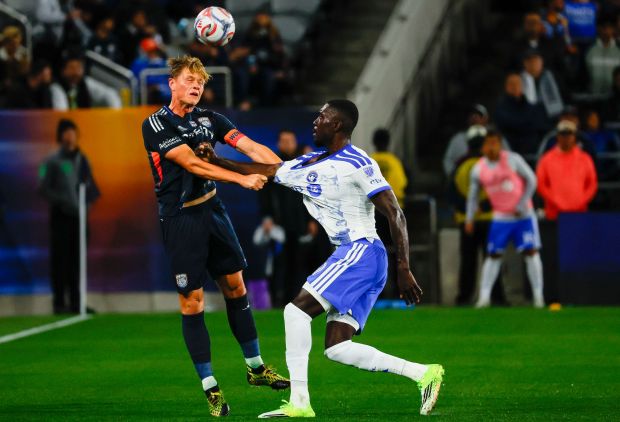 Jeppe Tverskov of San Diego FC heads the ball against Prince Owusu #9 of CF Montreal during the season opener at Snapdragon Stadium on Saturday, Feb. 21, 2026 in San Diego, California. (Meg McLaughlin / The San Diego Union-Tribune)