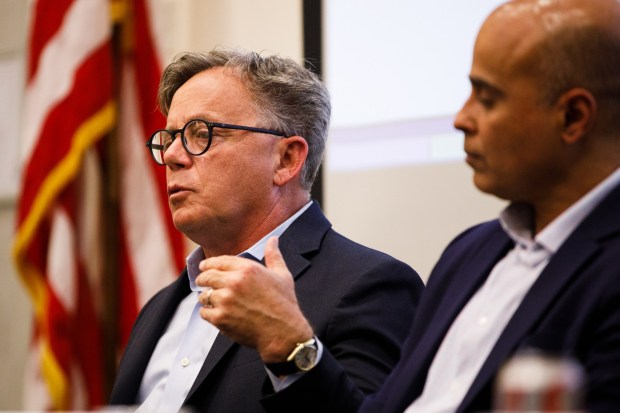Josh Newman, former state senator, speaks during a candidate forum at San Diego City College as Gus Mattammal listens on Thursday, April 16, 2026. (Kristian Carreon / The San Diego Union-Tribune)