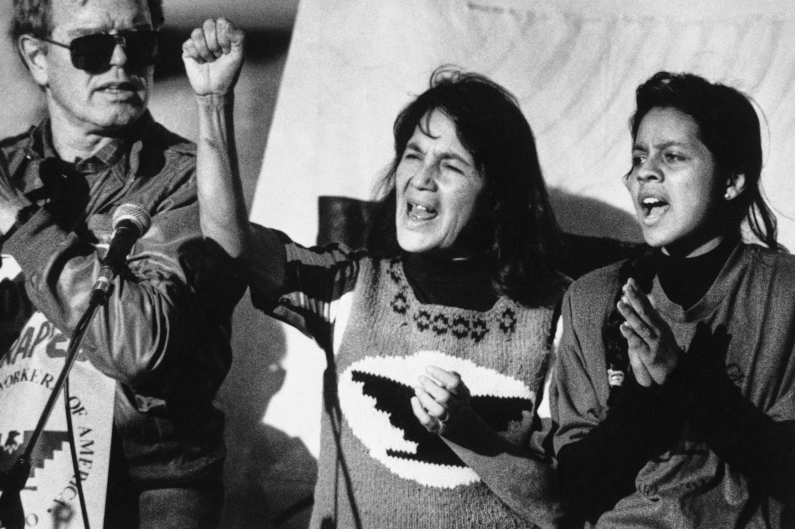 United Farm Workers leader Dolores Huerta, center, leads a rally...