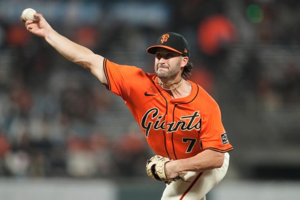 San Francisco Giants pitcher Trevor McDonald throws against the Colorado Rockies during the first inning of a baseball game in San Francisco, Friday, Sept. 26, 2025. (AP Photo/Jeff Chiu)