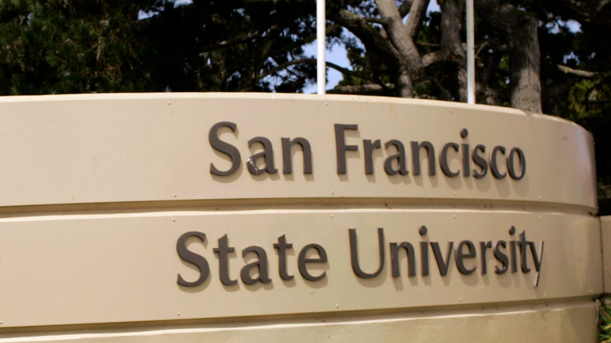 A student walking on the campus of San Francisco State University in San Francisco