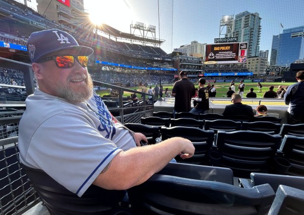Temecula's Arthur Saunders was the lone man in blue among all the brown Mopnday behind the Padres dugout. (Kirk Kenney / San Diego Union-Tribune)