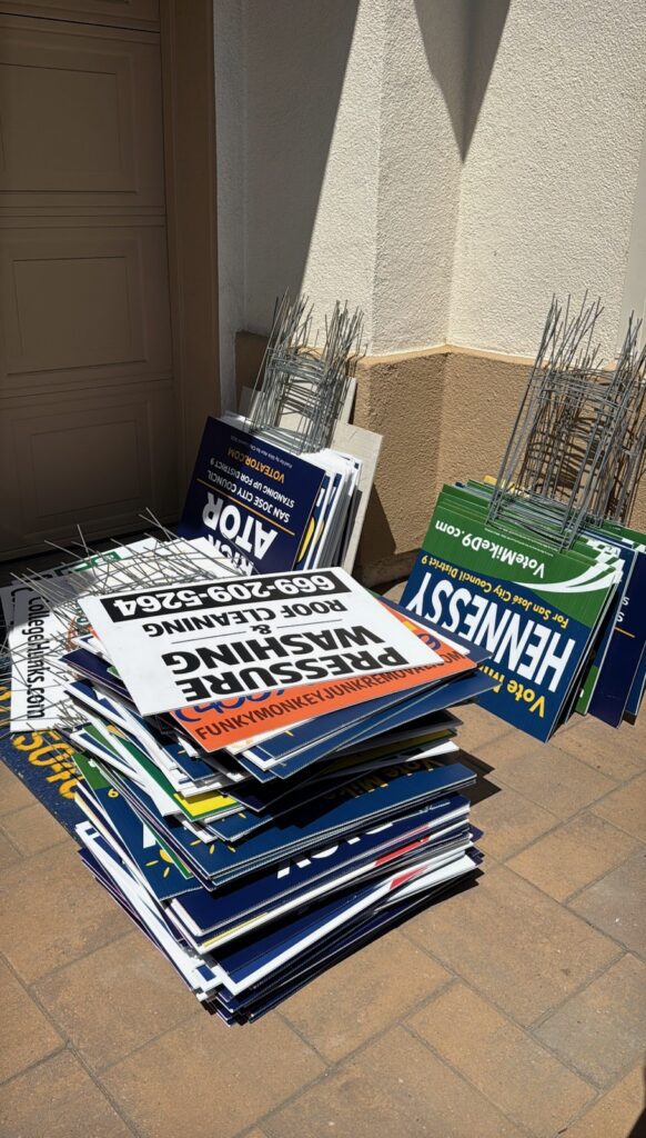 Campaign signs stacked high.