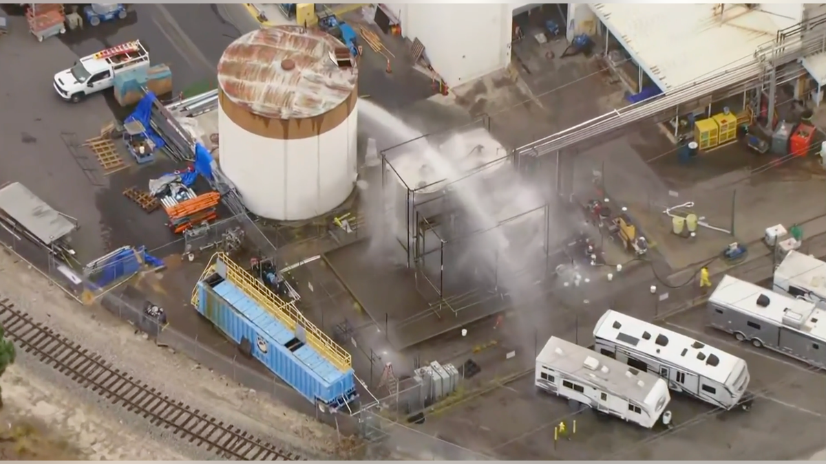 Fire officials said a large chemical tank was at risk of spilling or exploding, possibly igniting nearby chemical tanks.