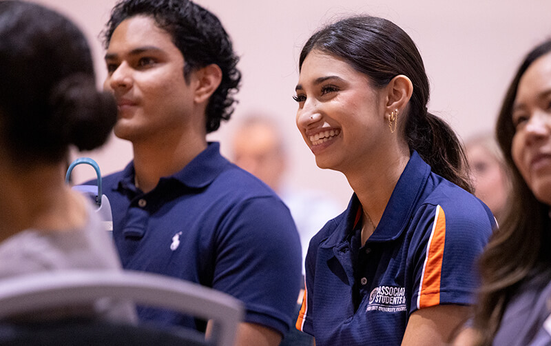 English major Haneefah Syed sitting with fellow student leaders