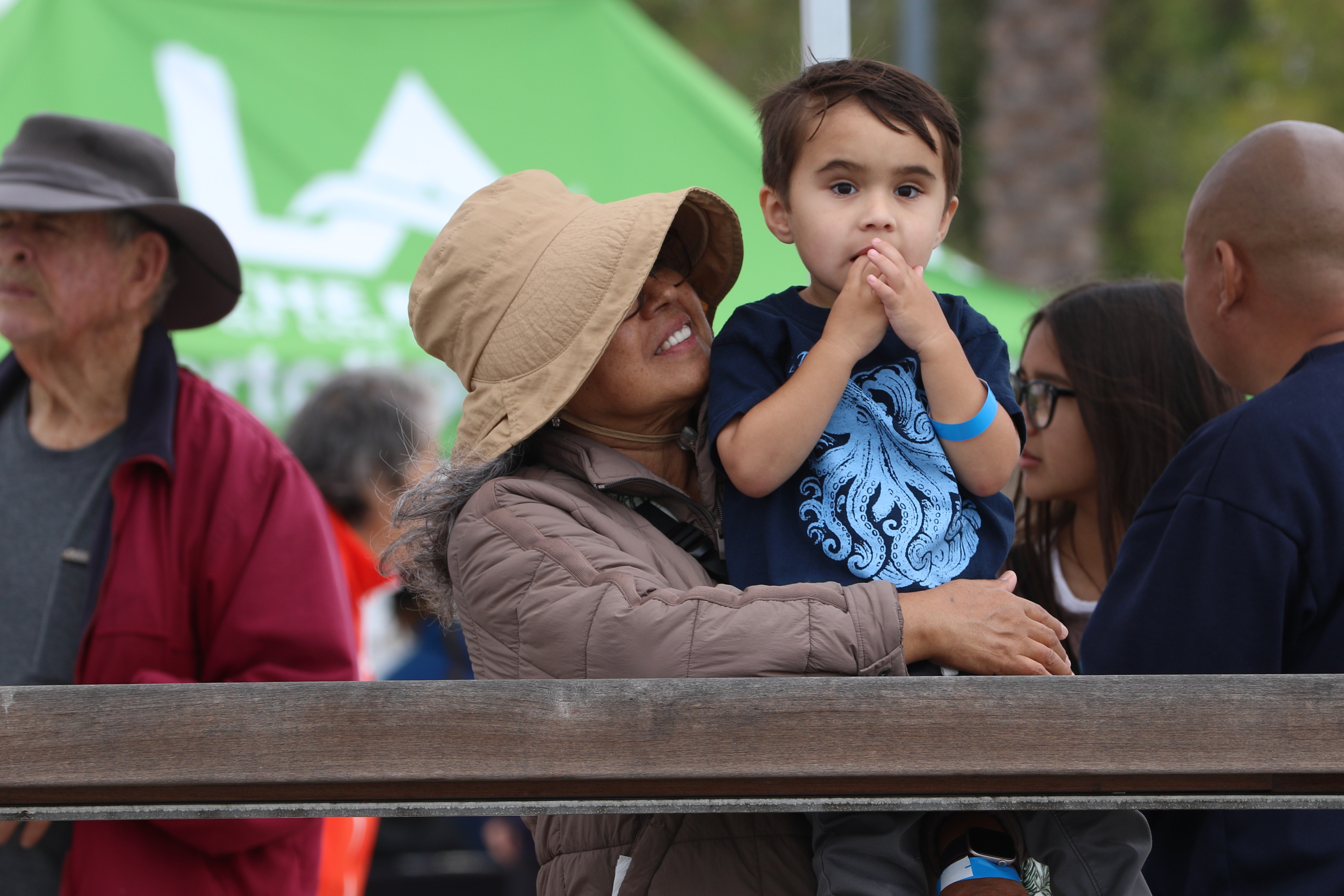 Martha Guzman of Wilmington and her grandson, Mason Rand, wait...