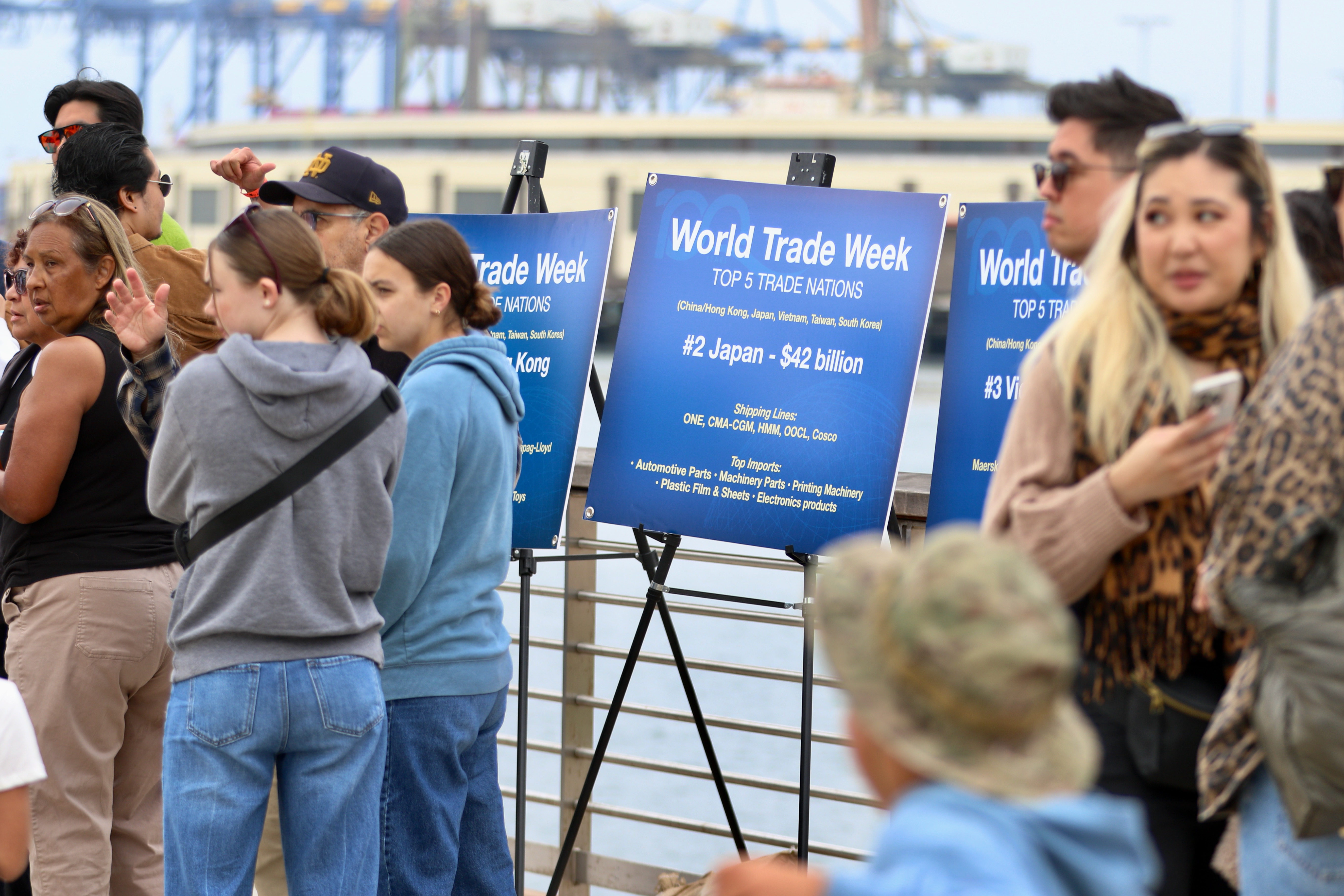 Passengers wait to board boats for free tours of Los...
