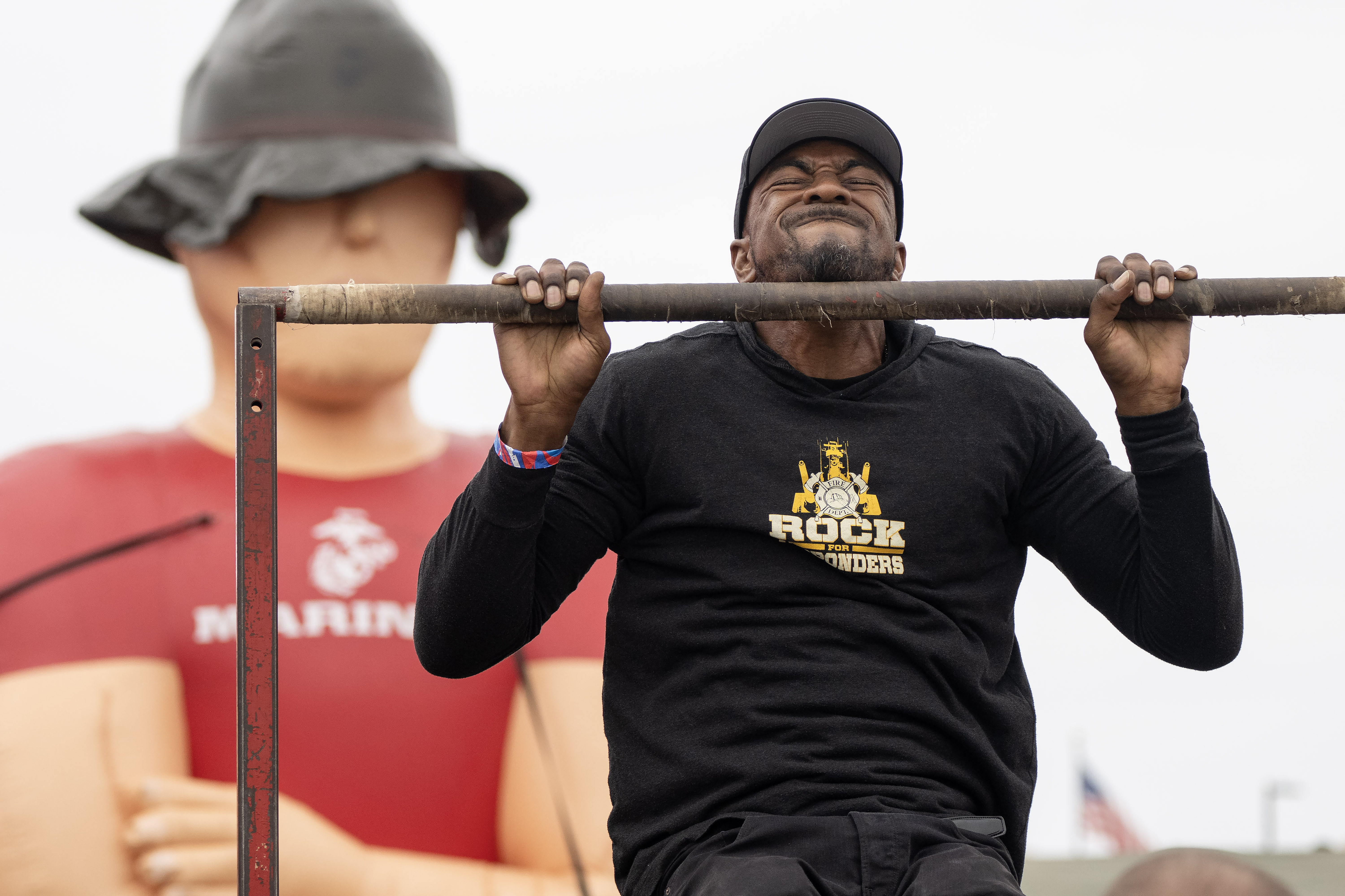Haneef Munir performs 25 chin-ups during day one of the...