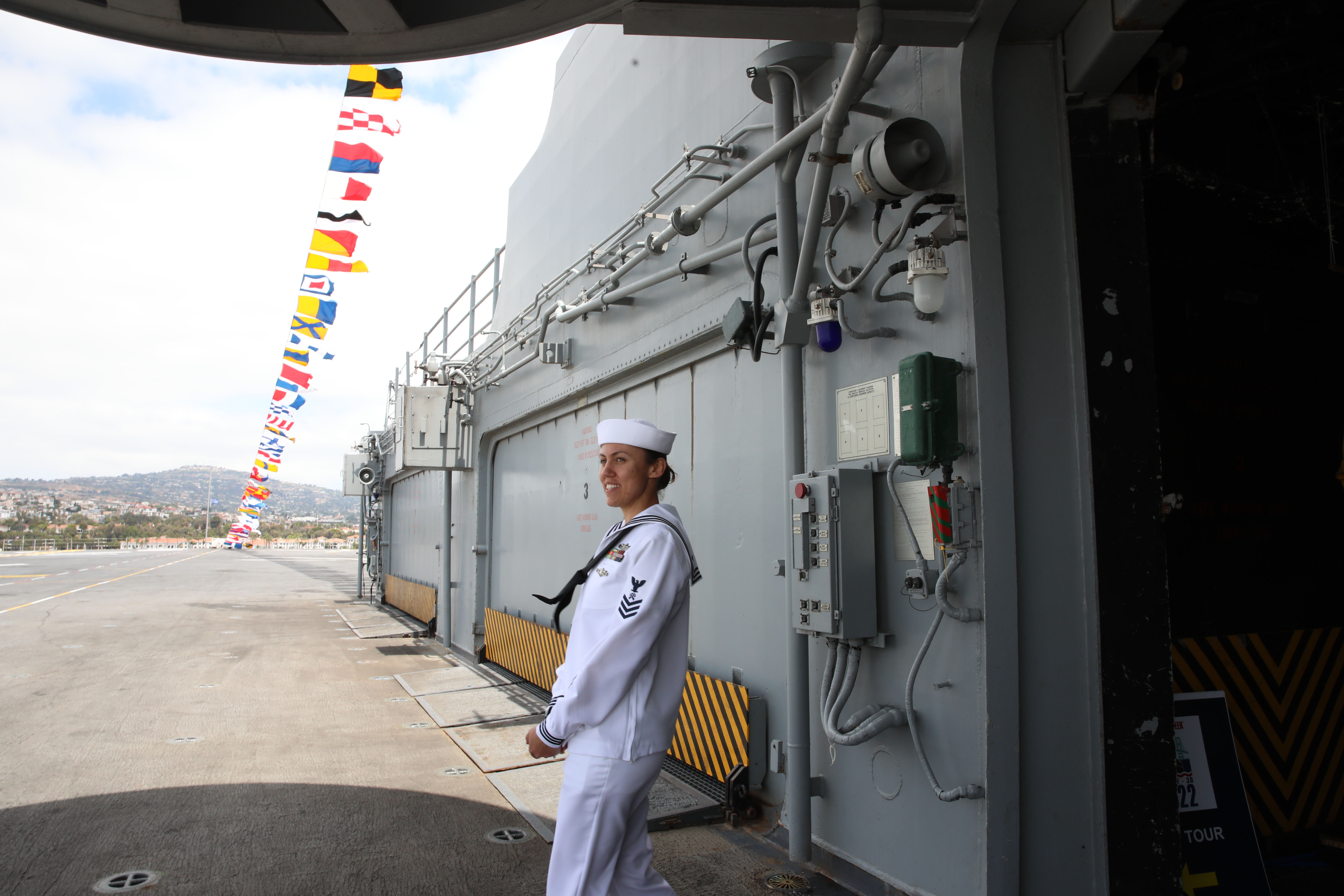 Logistics Specialist 1st Class Melanie Carney looks out onto the...