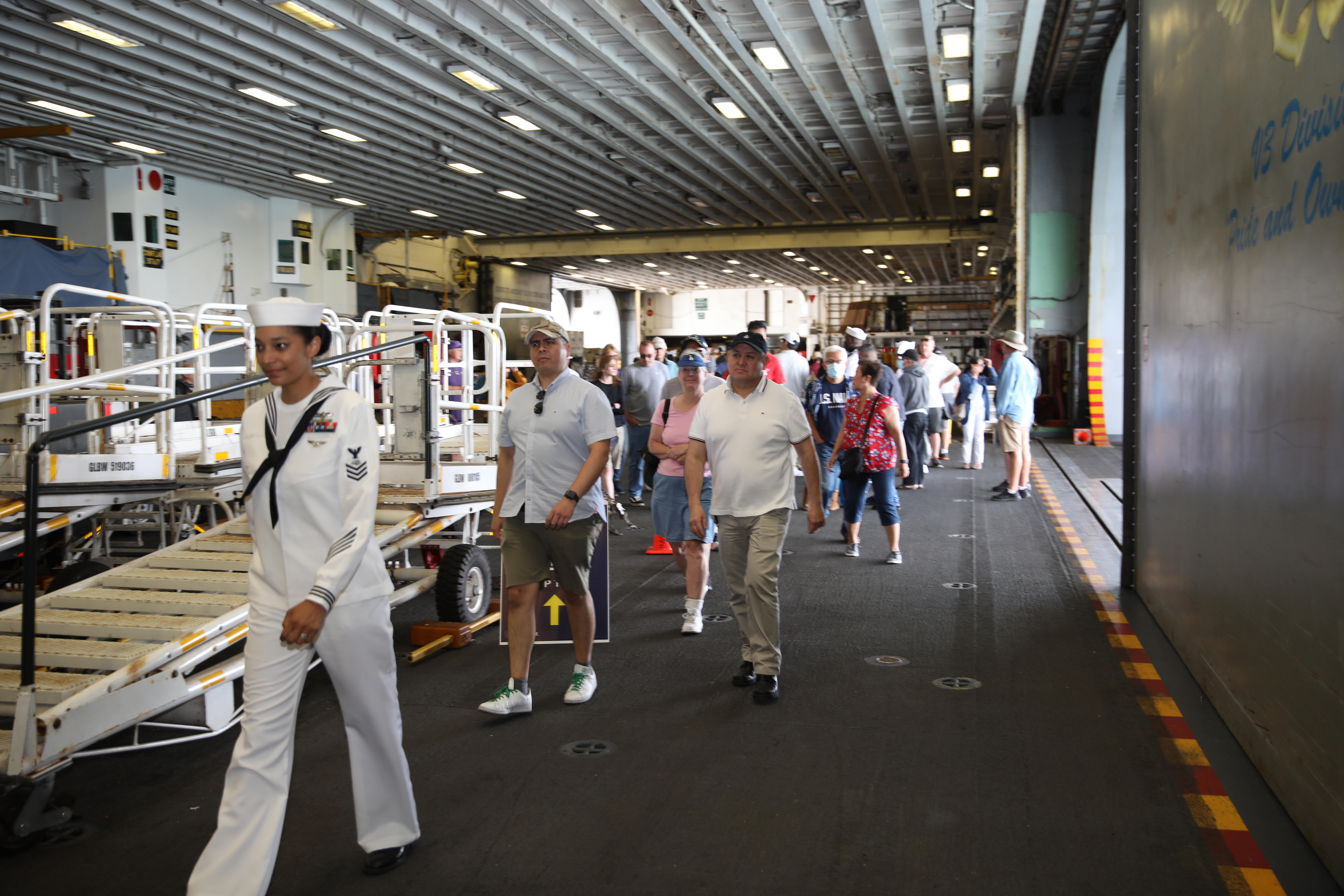 Visitors tour the Hangar Bay of the USS Essex on...