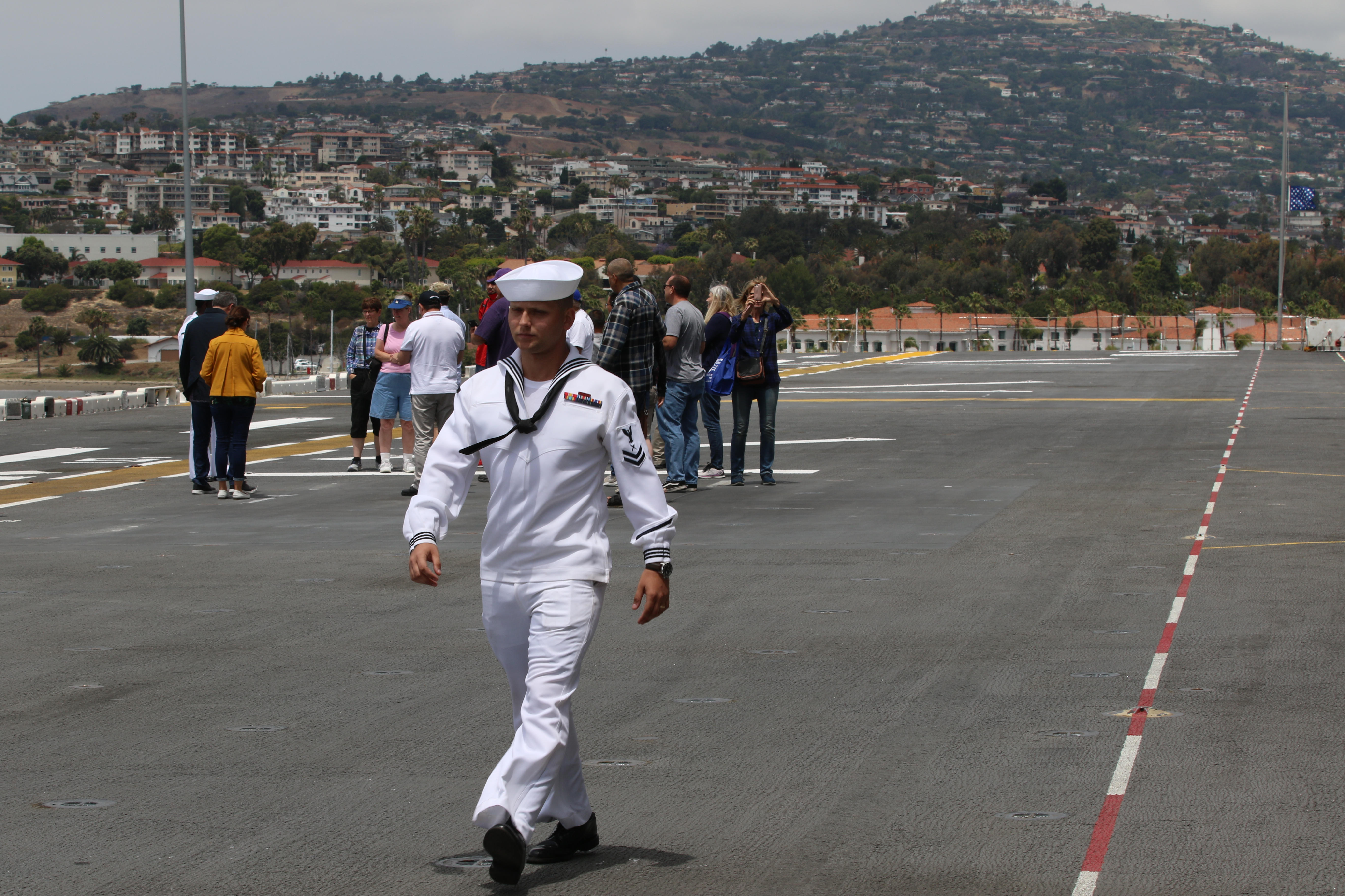 Navy cryptologic technician 2nd Class Jerame Goodman struts along the...