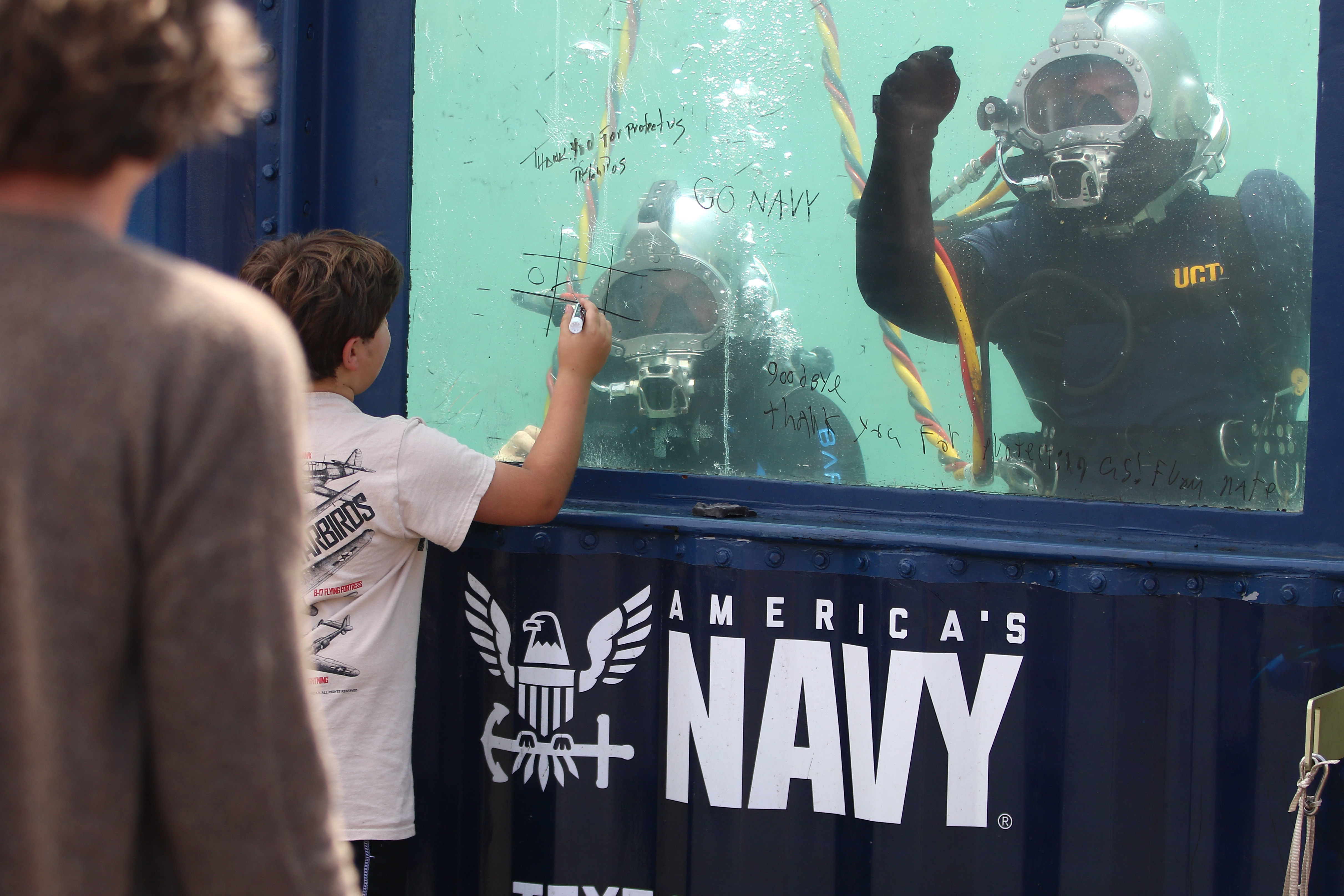 Navy divers interact with young visitors at LA Fleet Week...
