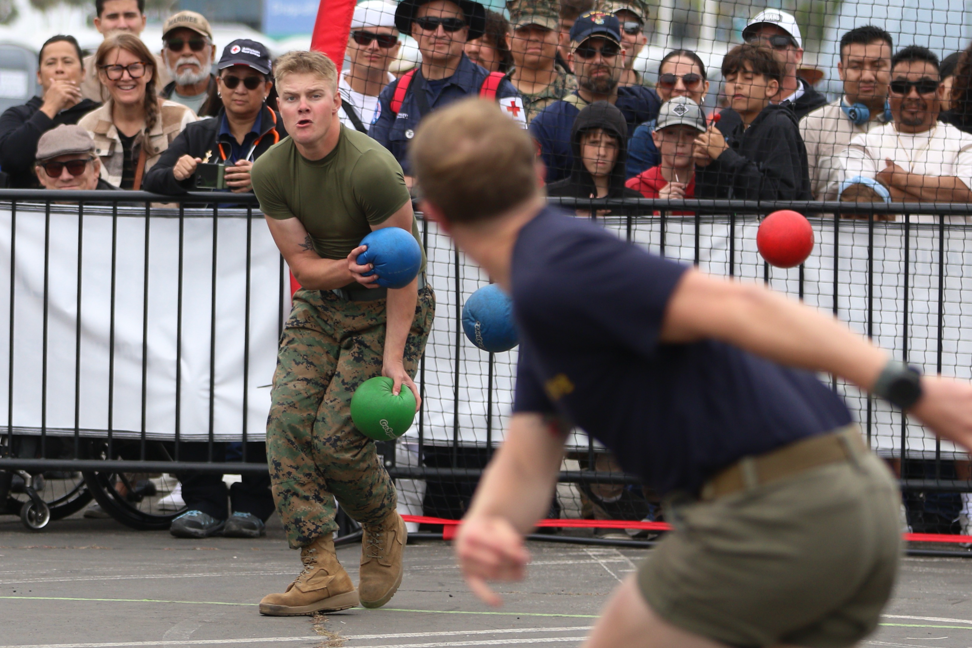 Players compete in the military dodgeball tournament on Sunday, May...