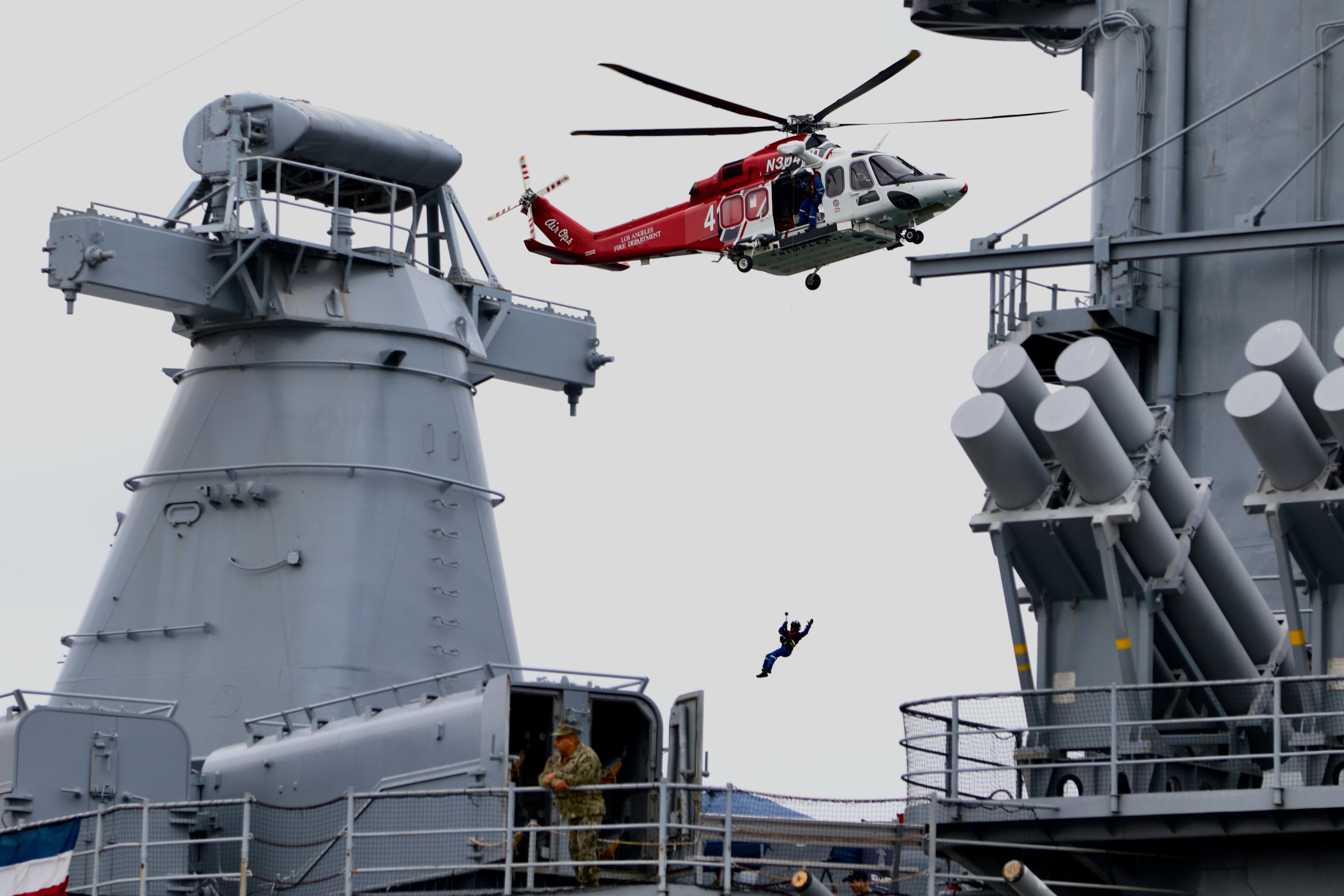 A twin-engine Los Angeles Fire Department helicopter performs an aerial...