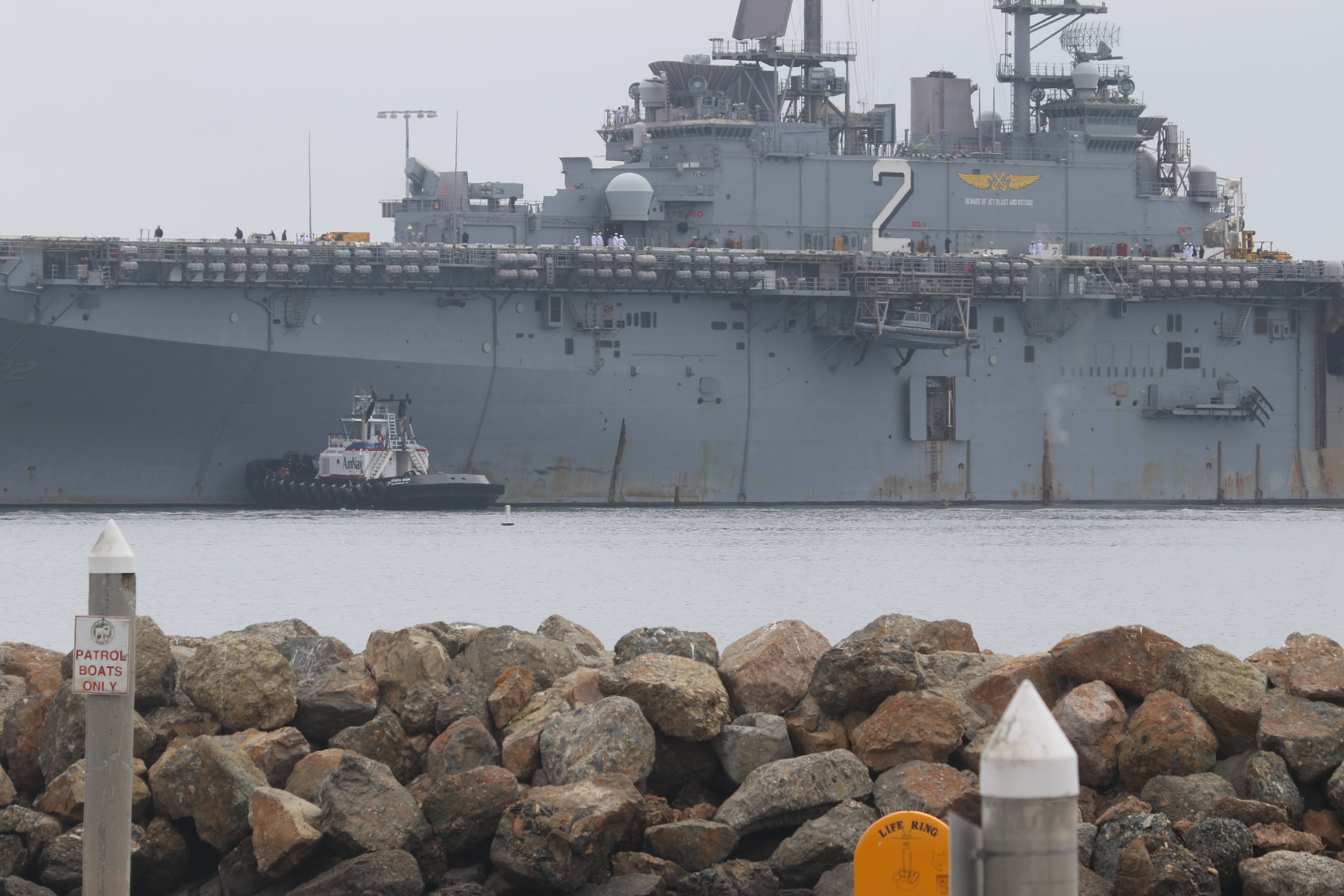 The USS Essex is visible from Cabrillo Beach after its...
