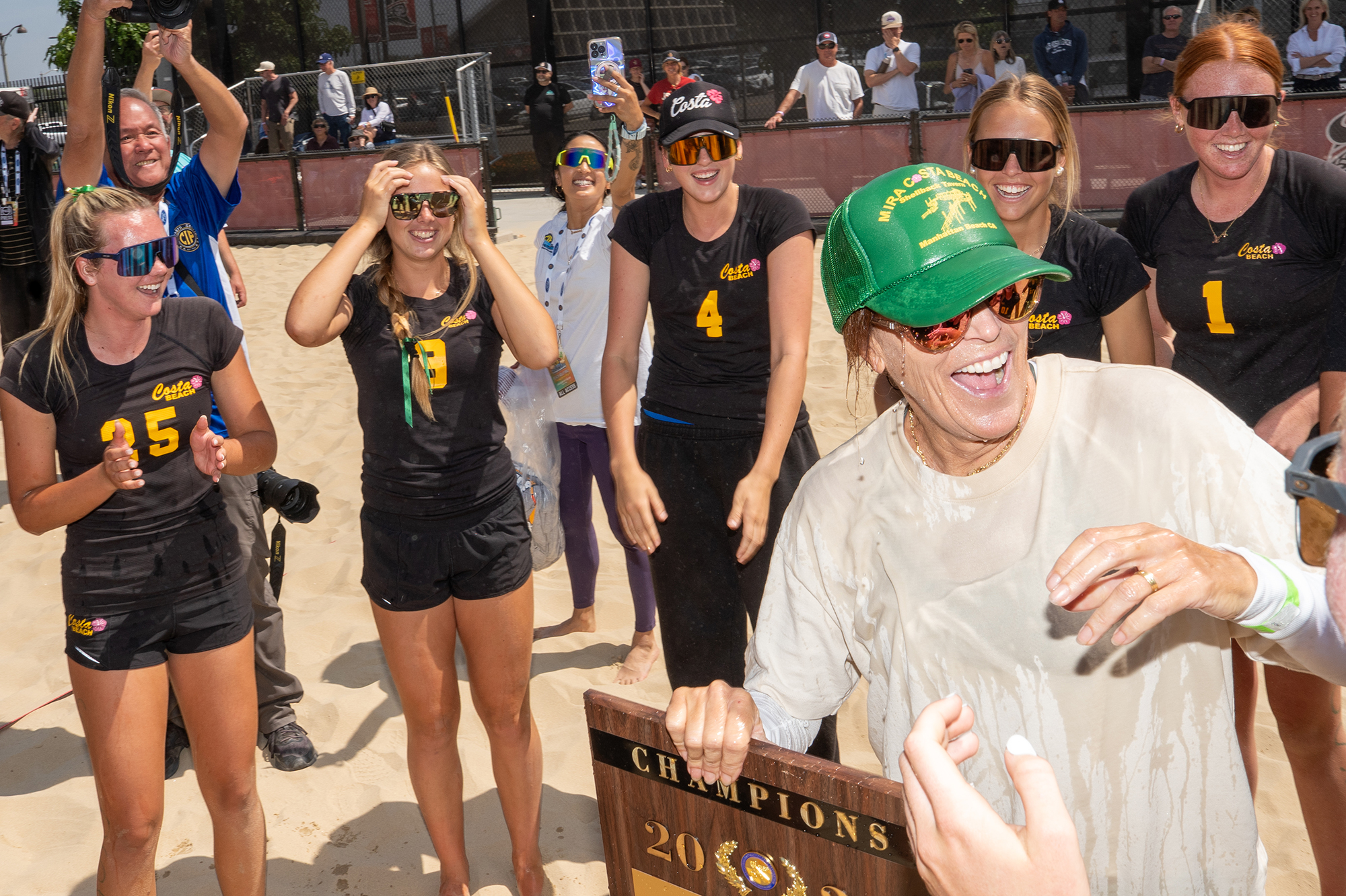 Nancy Reynolds, coach of Mira Costa High School, celebrates with...