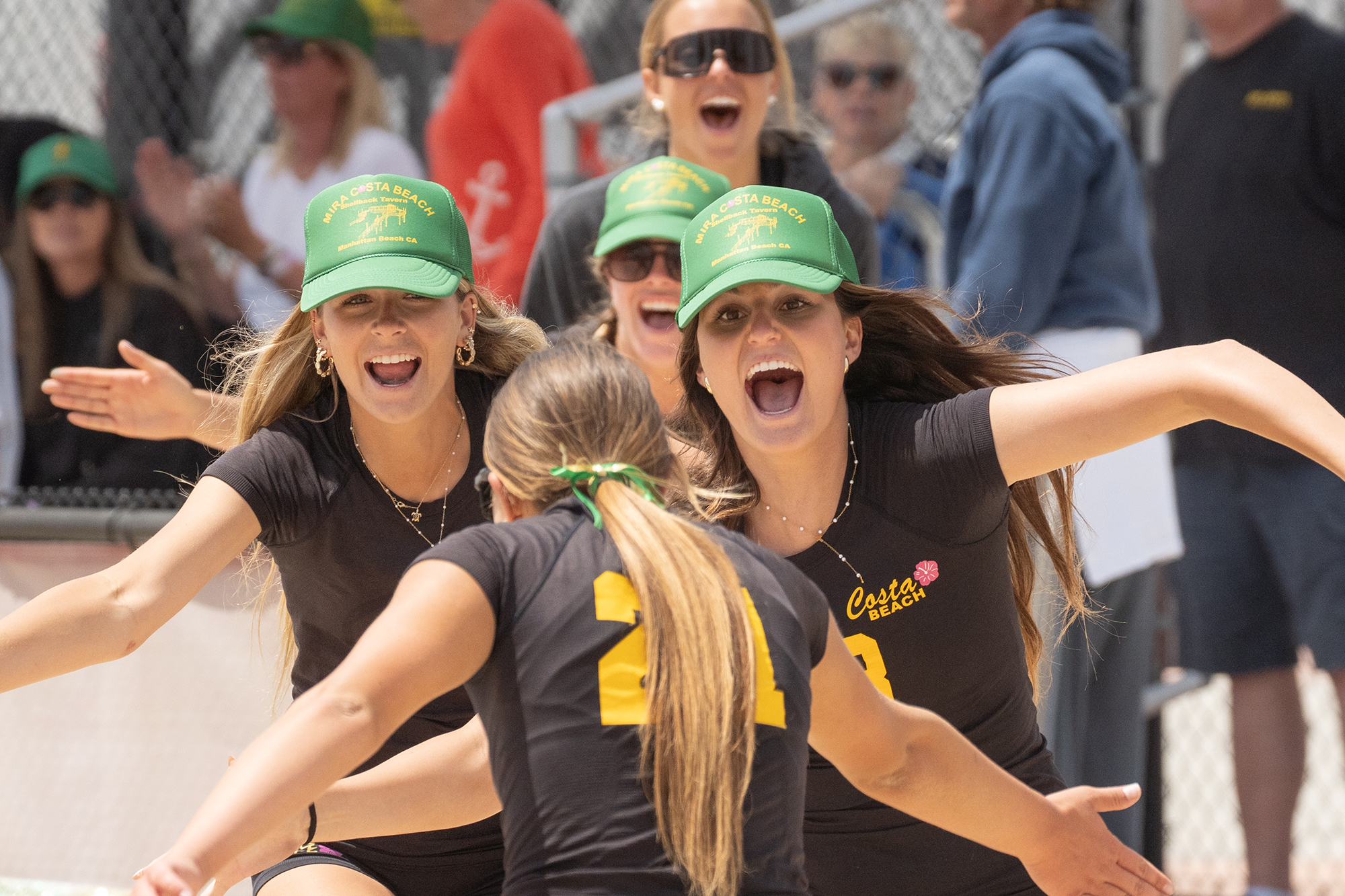 Mira Costa High School players celebrate after winning a match...
